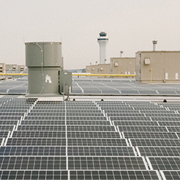 Rows of solar panels on a rooftop. 