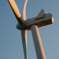 A close-up view from the side of a wind turbine. 