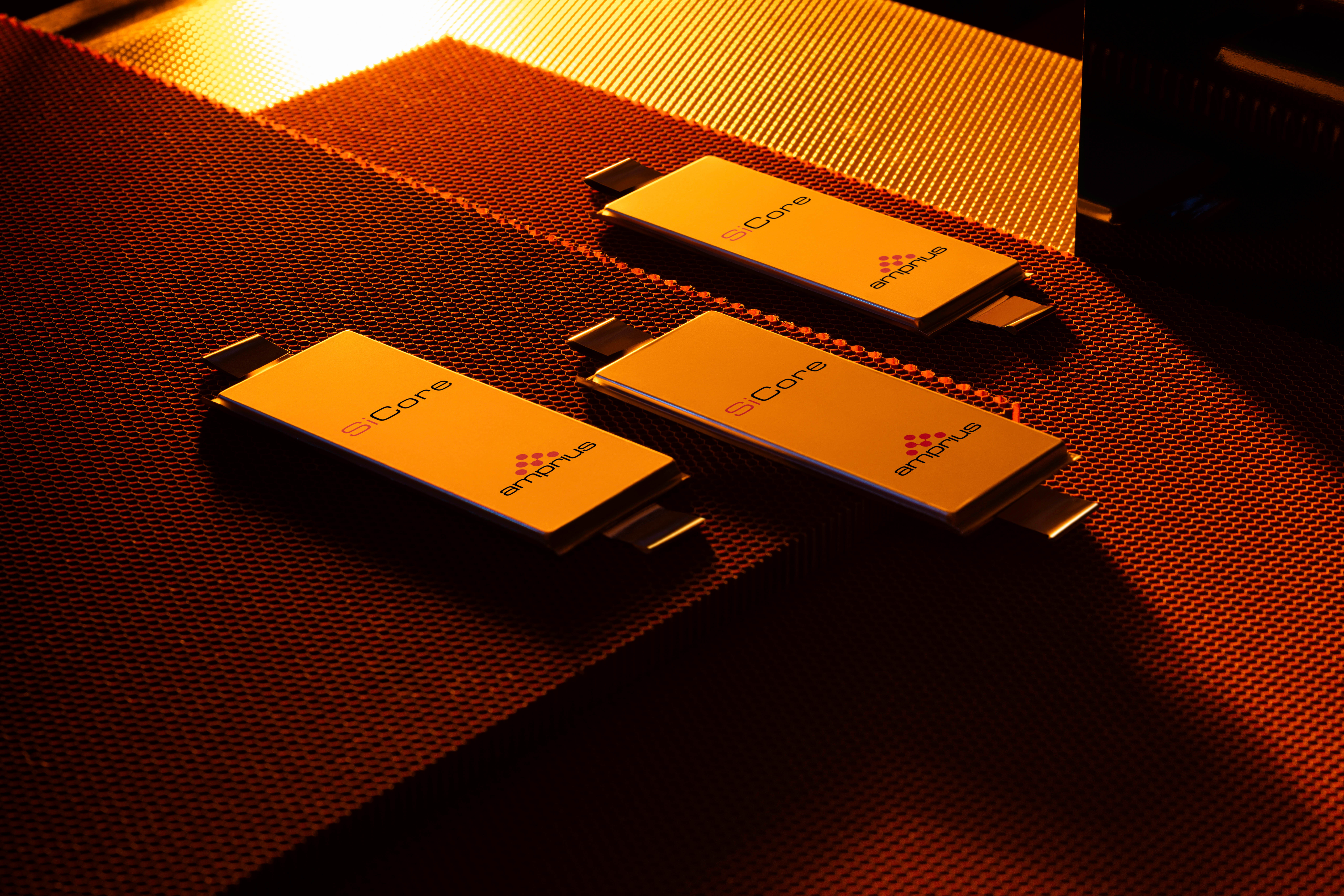 Several technical computer components sit on a desktop.