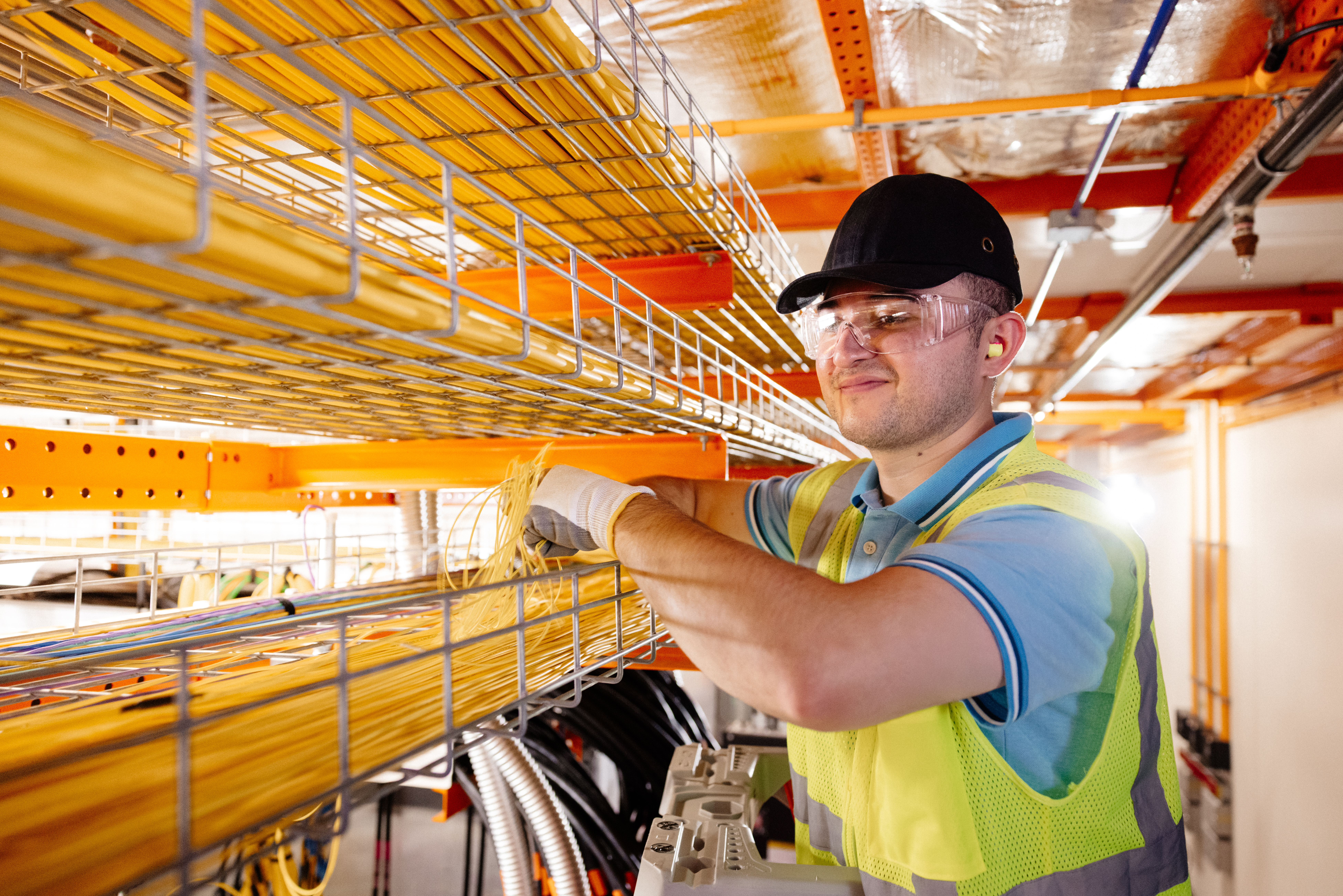 A person working with cables.