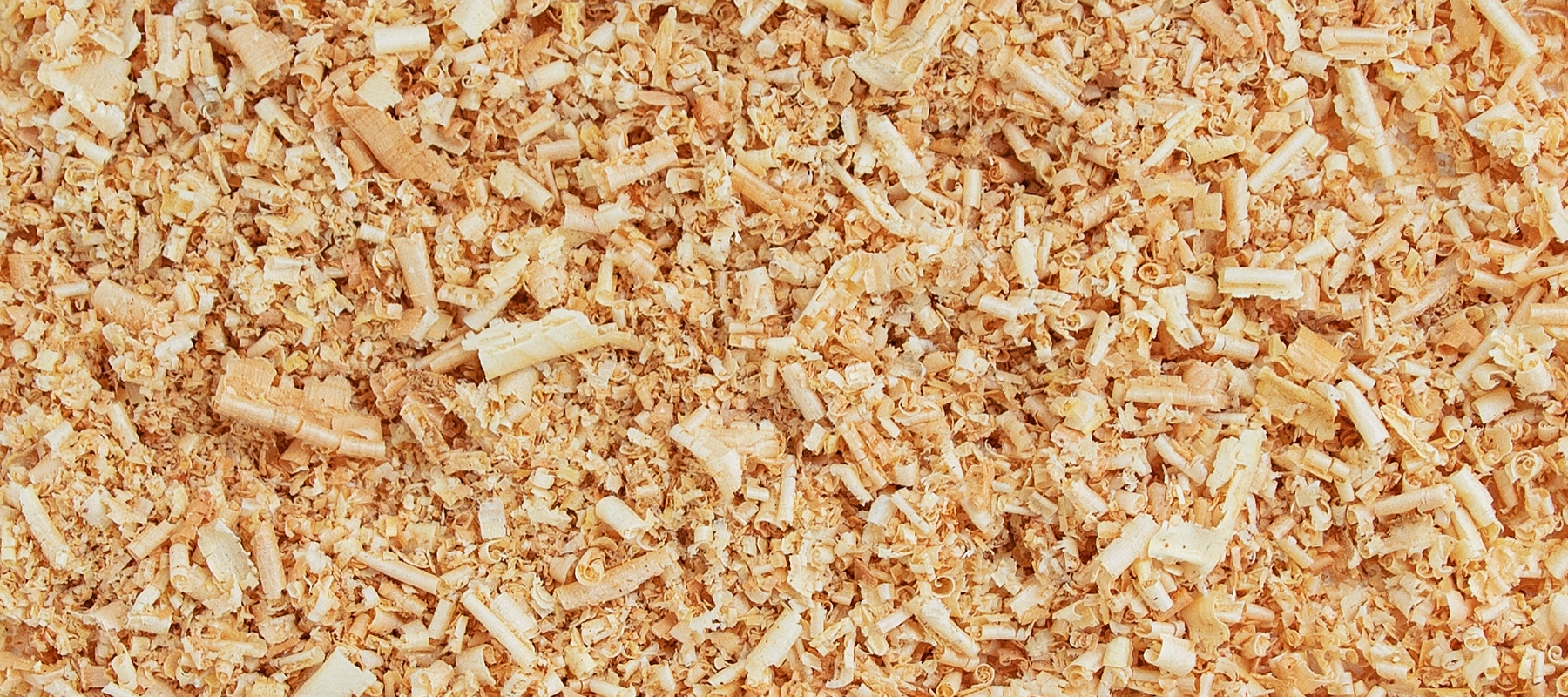 A close-up view of wood chips in a pile. 