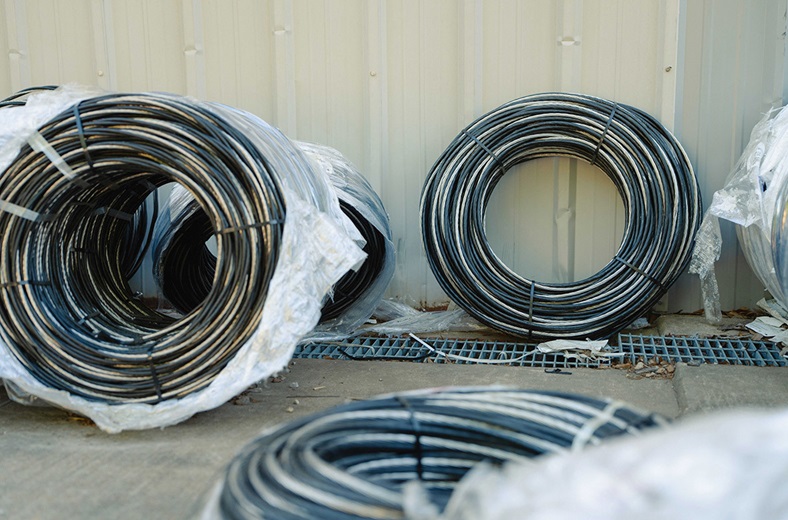 Coils of electrical wire await installation.