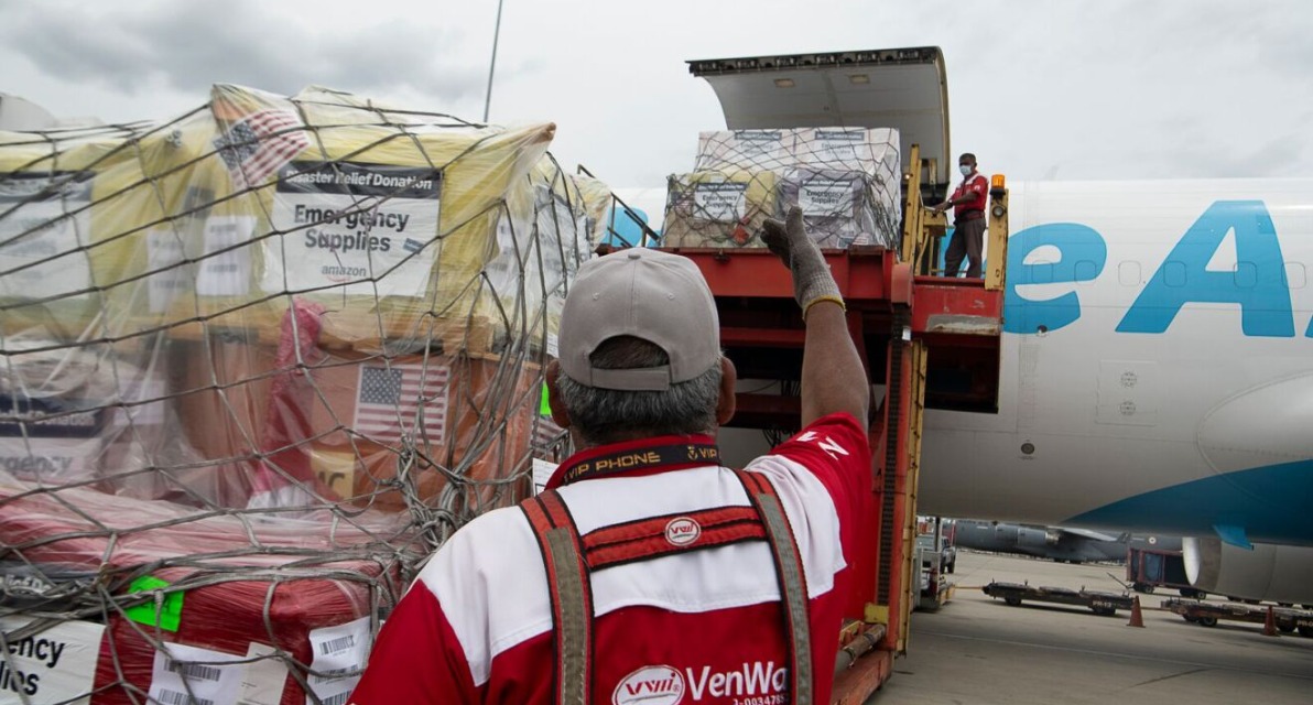 Amazon employees unload emergency supplies for earthquake relief in Caracas, Venezuela, on July 3, 2026.