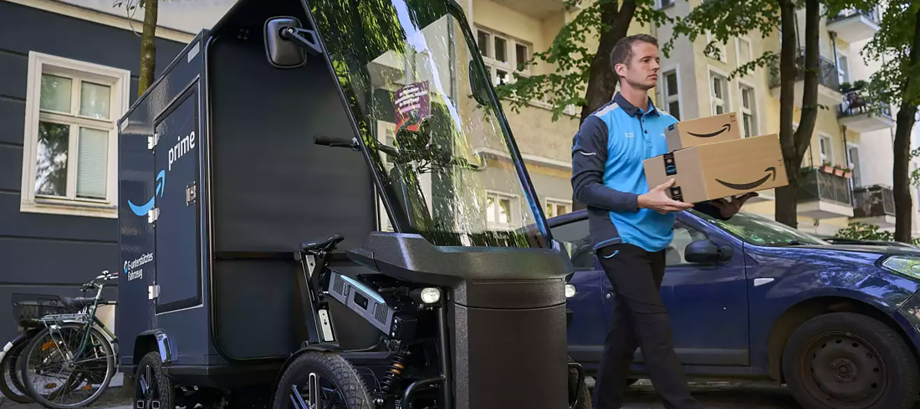 A person carries packages from a delivery vehicle 