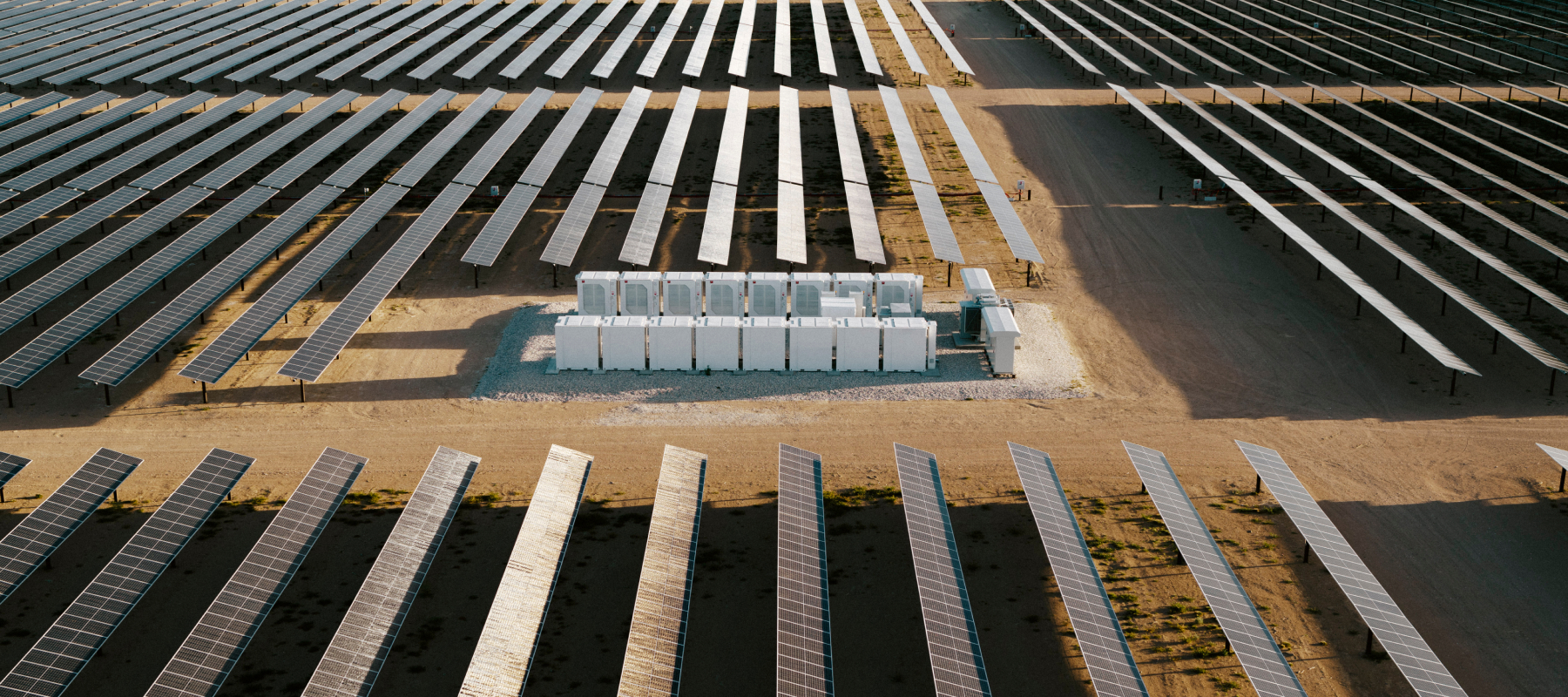 An aerial view of solar panels in a desert climate.