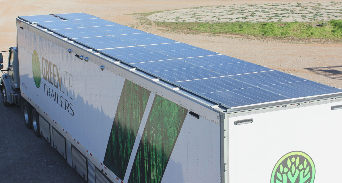 A truck drives through a desert landscape.